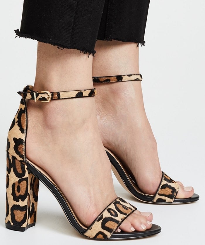 Modern and minimalist, an essential ankle-strap sandal set on a chunky wrapped heel serves as a versatile go-to style