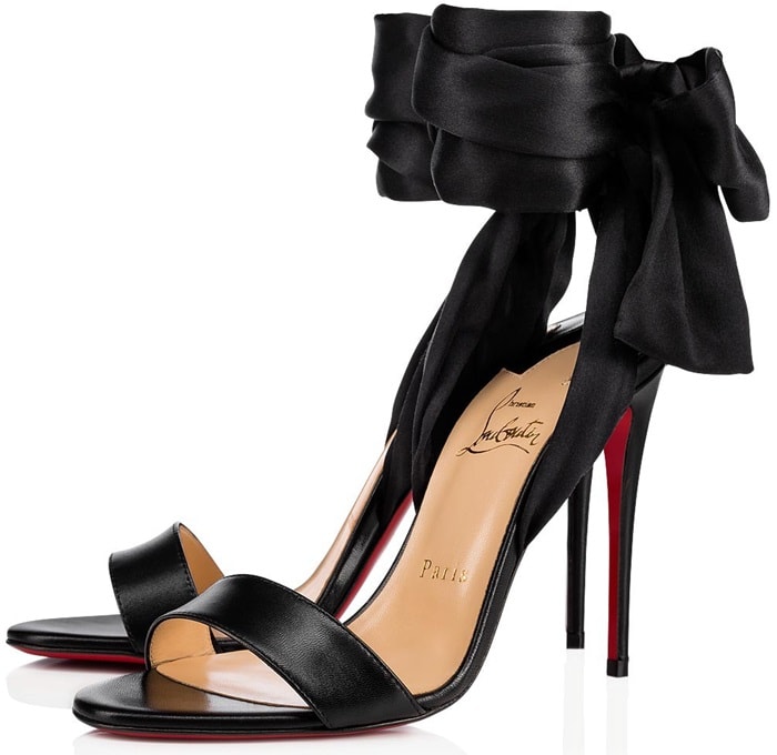 With its crepe satin ankle scarf, Christian Louboutin's black kidskin Sandale du Désert evokes a Middle Eastern woman's light and airy veil.