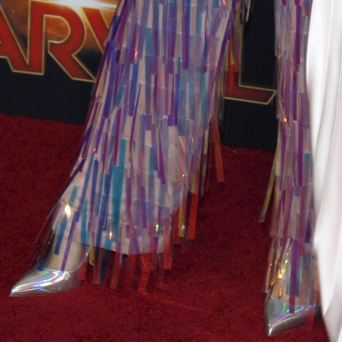 Gemma Chan's iridescent fringed pants and luminous Hot Chick pumps