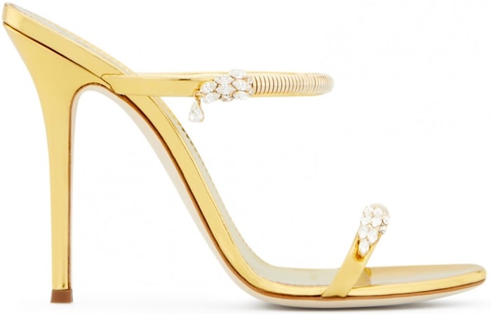 Made from gold shooting patent leather, these sandals are embellished with jewels on the straps