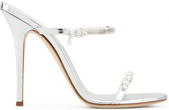 Made from silver shooting patent leather, these sandals are embellished with jewels on the straps