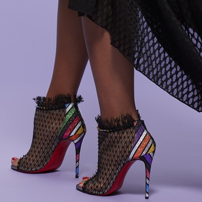 A sensual arch that follows through to a counter and 100mm slim stiletto heel both crafted in this season’s Velukid Strippyglitter brings back the 1970’s and disco nights