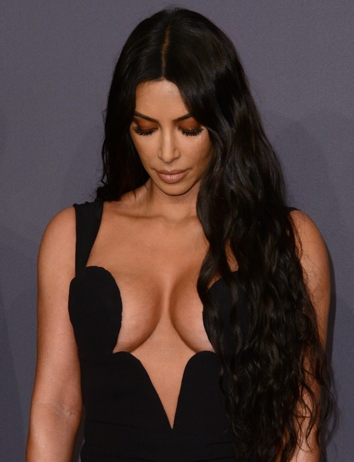 Kim Kardashian checks out her breast tape