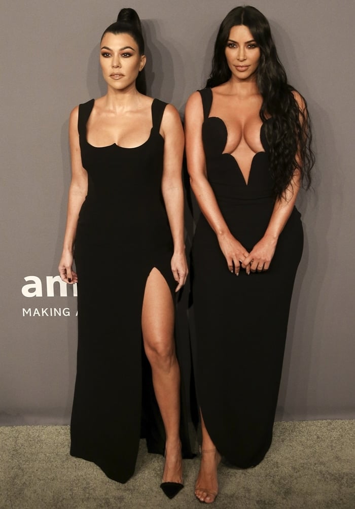 Kourtney Kardashian and Kim Kardashian pose together at the 2019 amfAR New York Gala held at Cipriani Wall Street in New York City on February 6, 2019