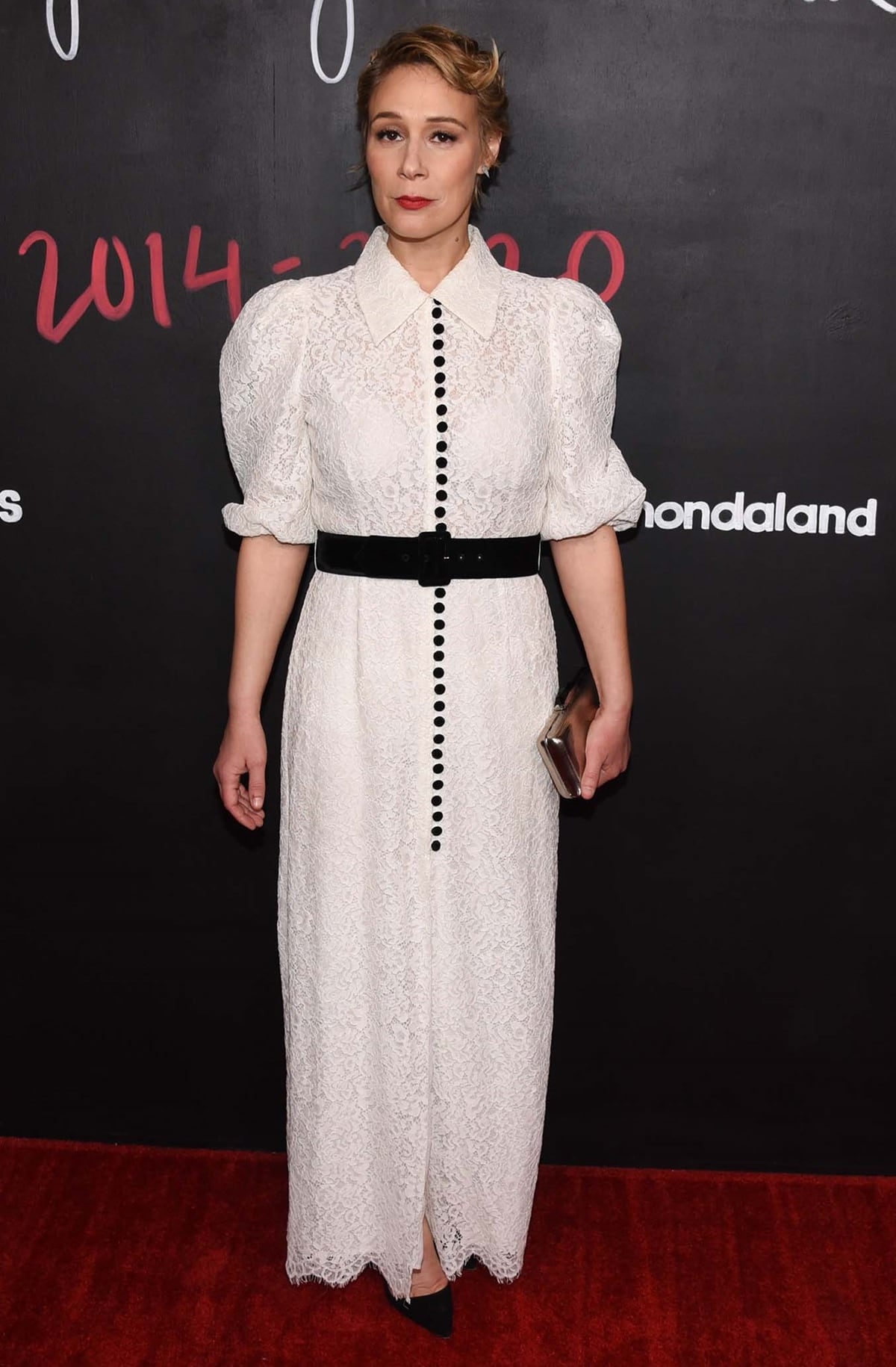 Liza Weil exudes elegance in a vintage-inspired white lace dress, cinched with a bold black belt, at the How to Get Away with Murder wrap party