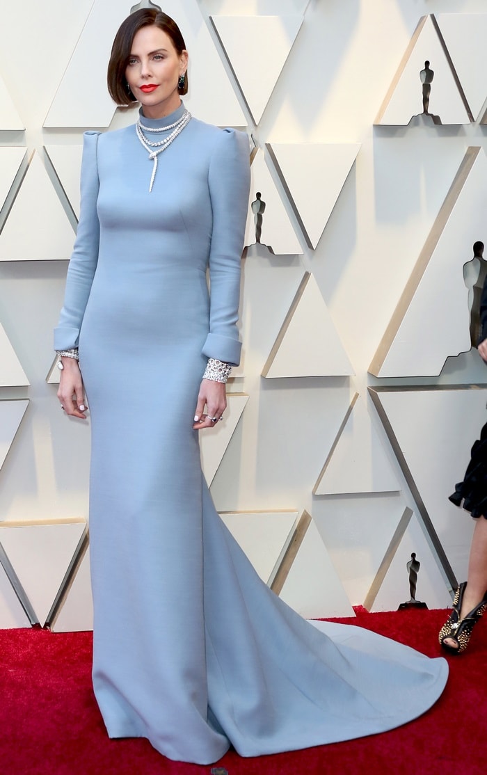 Charlize Theron looked matronly in a backless dress while walking the red carpet at the 2019 Academy Awards at the Dolby Theatre in Los Angeles on February 24, 2019