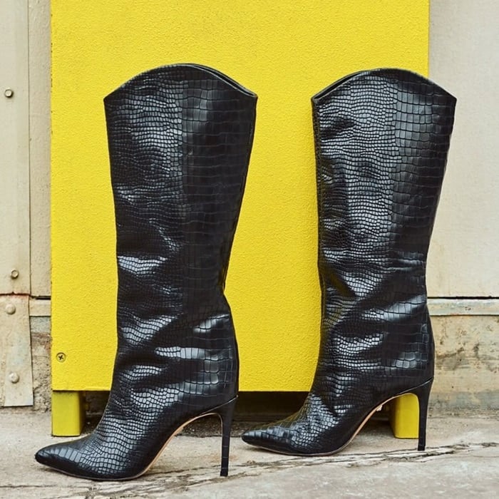 Embossed leather adds a touch of southwestern style to a pointy-toe boot lifted by a slimmed-down heel
