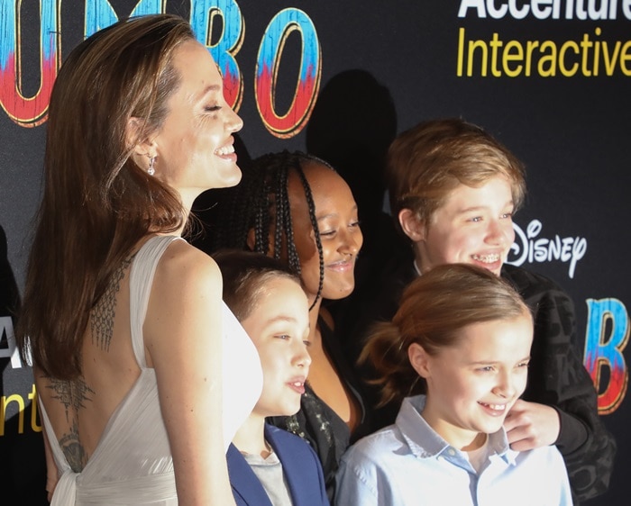 Angelina Jolie showed off her back tattoo in an open back dress