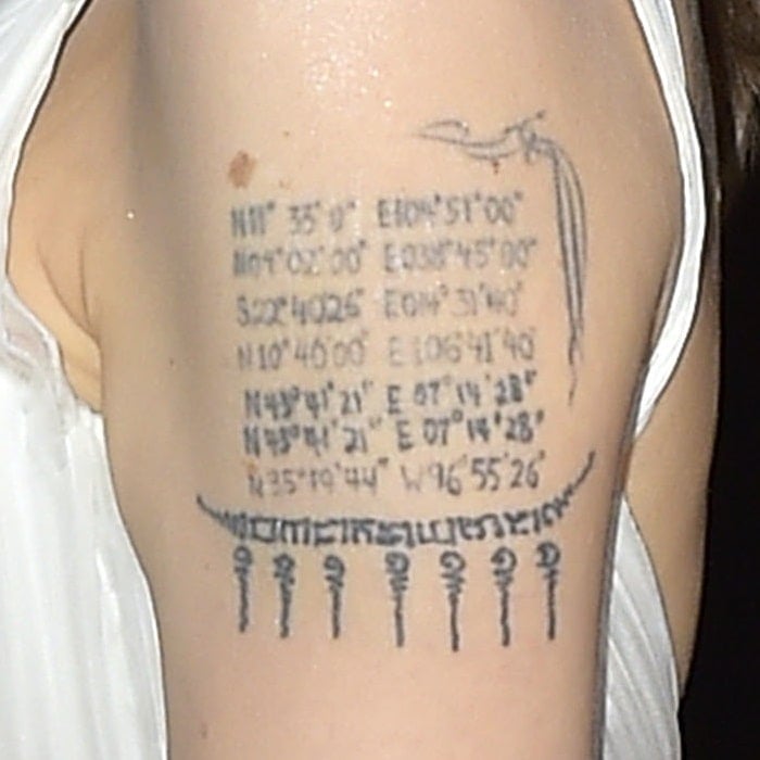 Angelina Jolie has the birthplace coordinates of all six children and her now-ex-husband Brad Pitt inked on her left arm