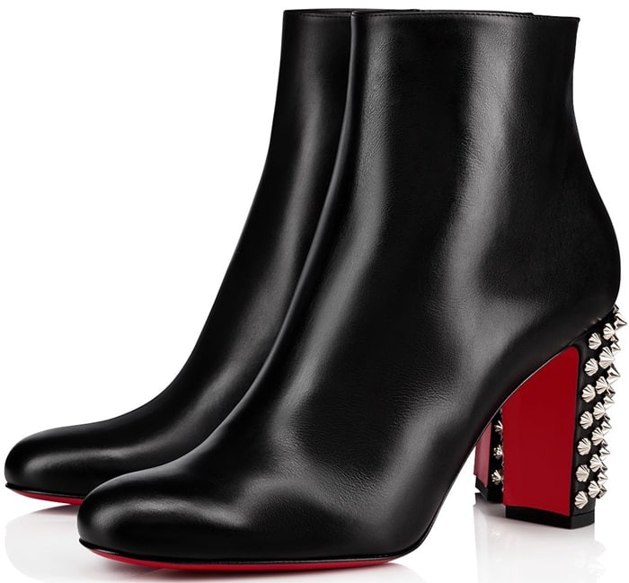 Crafted from black leather, the style features a heel studded with silver-tone spikes, as well as the iconic red outsole.