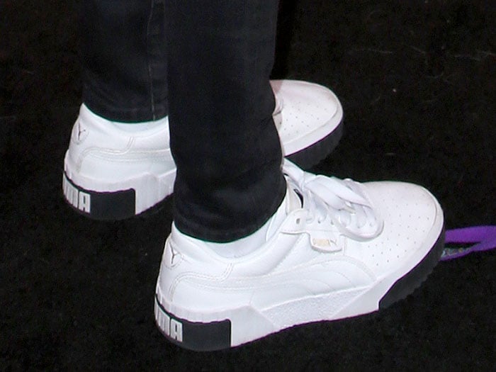 Cara Delevingne wears the revamped PUMA ‘Cali’ sneakers, a modern take on the brand’s classic 1980s California silhouette, featuring a chunky sole and bold branding at the heel