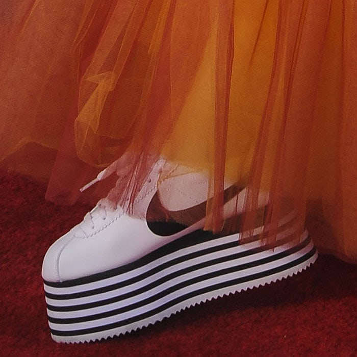 Comme des Garçons x Nike Cortez striped-platform sneakers on YouTube star, Poppy 