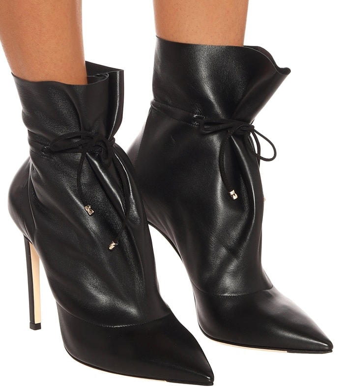 Crafted in Italy from buttery black leather, the pointed-toe silhouette features a tonal drawstring at the ankle, which gathers to form a slight pleat at the top.