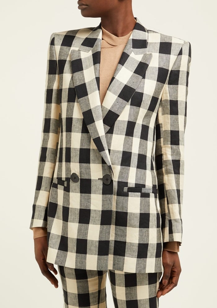 This blazer is rendered in a black and ivory check that gives a graphic dimension to the Vienna-based Petar Petrov's signature power-suit influenced silhouette