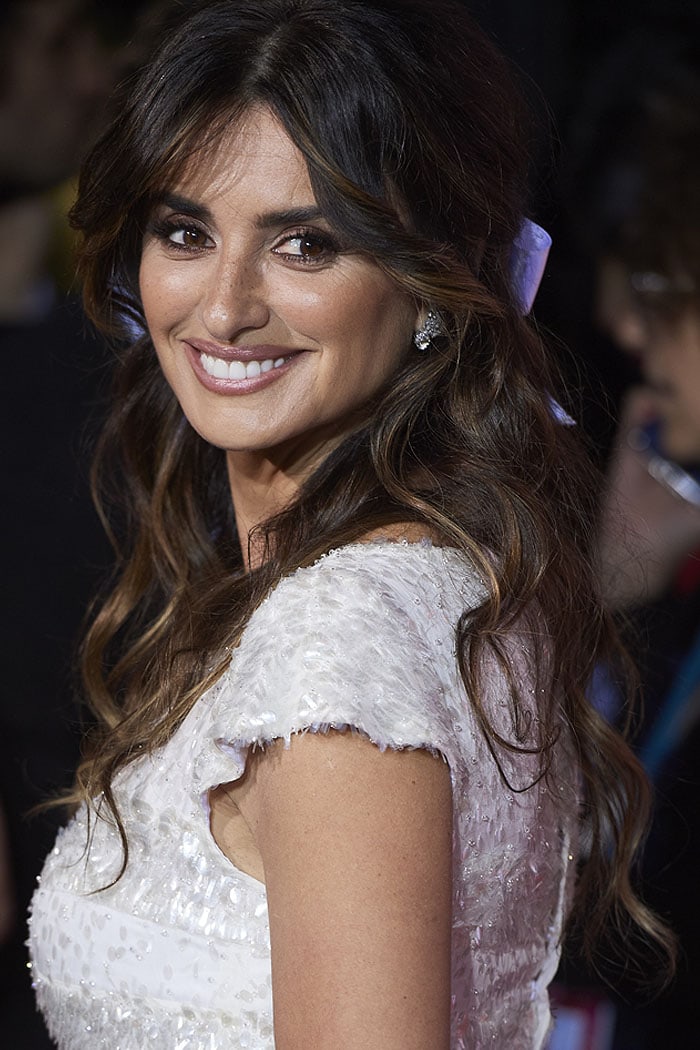 Penelope Cruz with a white ribbon in her brown hair