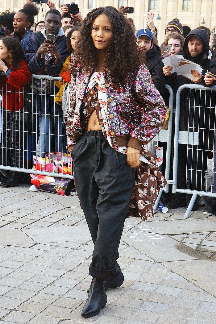 Thandie Newton rocking curly hair and a belly-baring outfit for the Louis Vuitton Fall 2019 fashion show