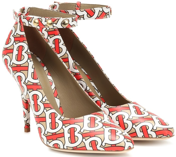 A lofty ankle-strap pump provides a bold take on logomania with its colorful print that pays homage to the brand's founder, Thomas Burberry