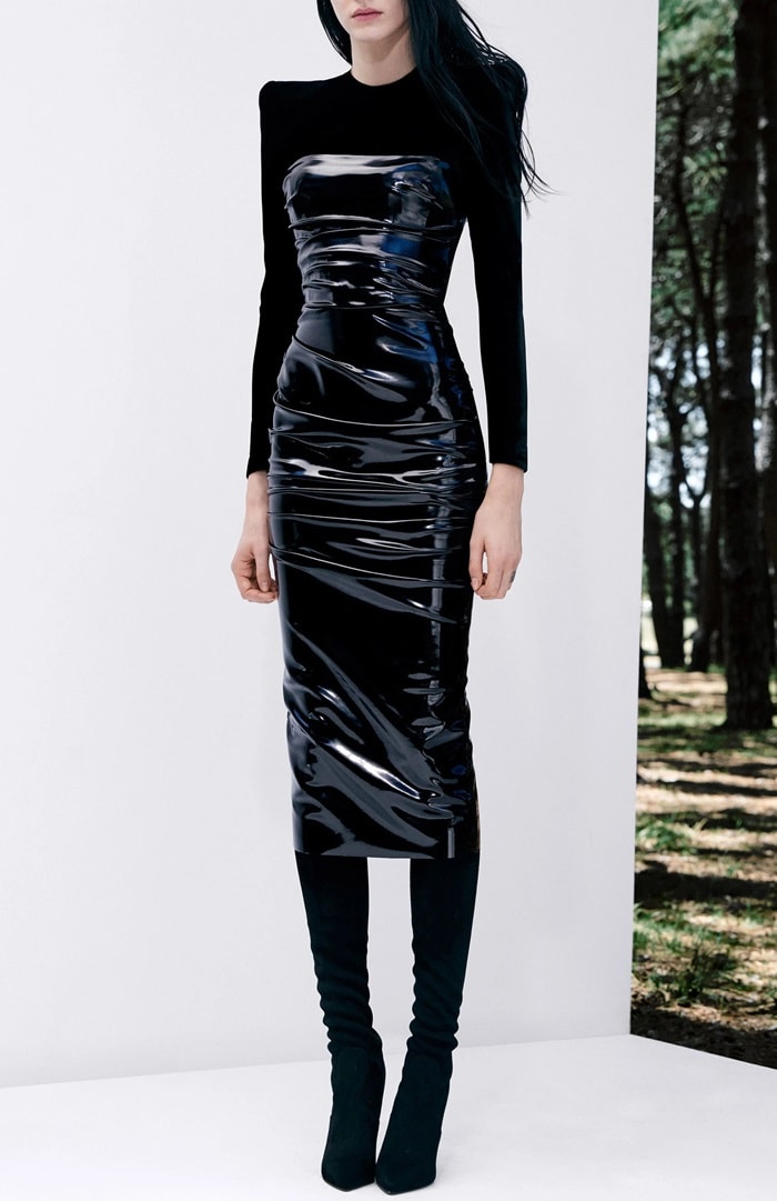 Crafted from stretch-jersey with a glossy vinyl overlay, the sexy dress hugs the body in a midi length silhouette