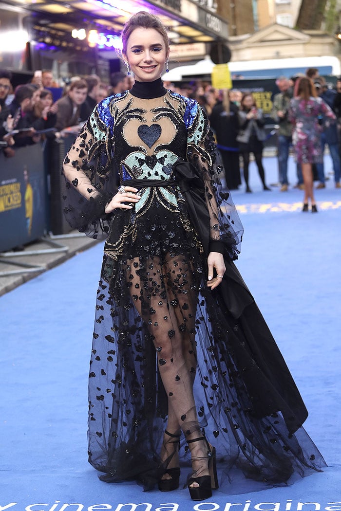 Lily Collins in an Elie Saab heart-sequined sheer gown and Giuseppe Zanotti Double Betty sandals