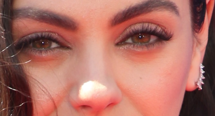 Mila Kunis' left eye is green and her much darker right eye is almost brown