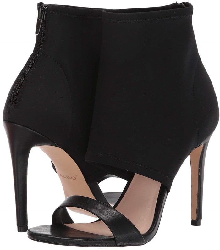 A tall stiletto heel and bootie-inspired silhouette push a peep-toe high heel caged sandal into sophisticated territory