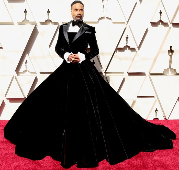 Billy Porter wears a Christian Siriano black velvet gown, Oscar Heyman jewelry, and Rick Owens shoes at the 2019 Academy Awards