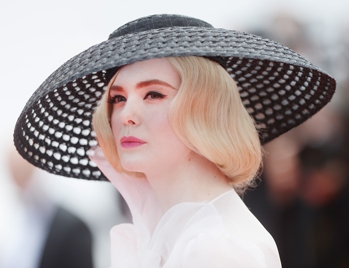 Elle Fanning's black wide-brim macramé hat