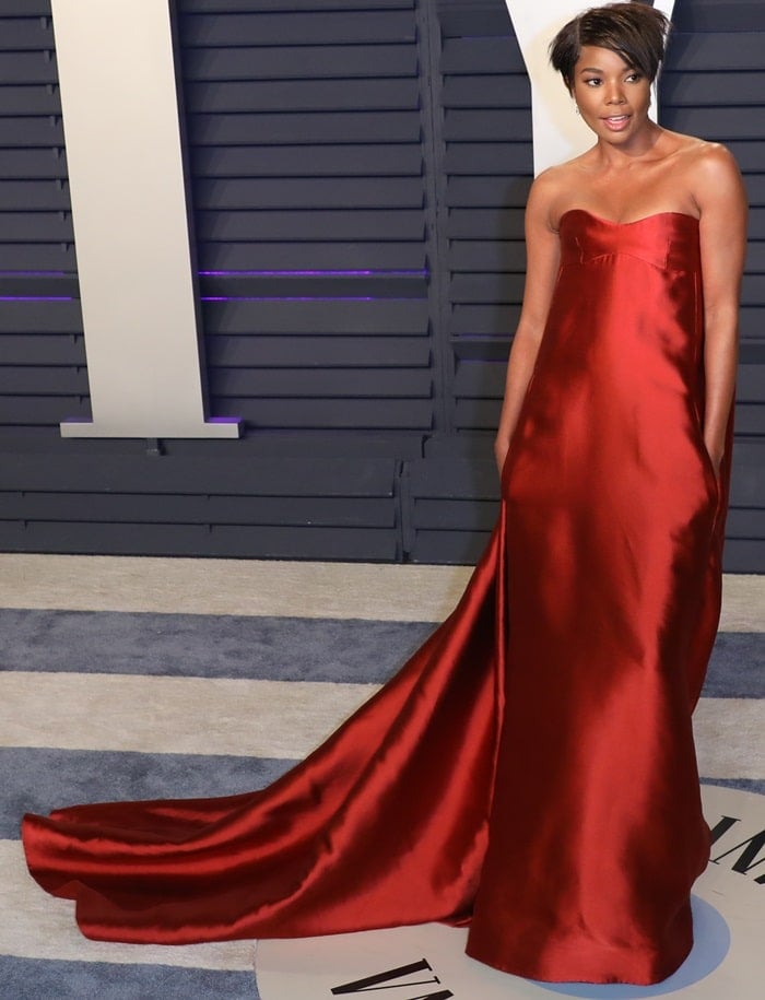 Gabrielle Union makes a striking statement in a flowing red Valentino Haute Couture gown at the 2019 Vanity Fair Oscar Party