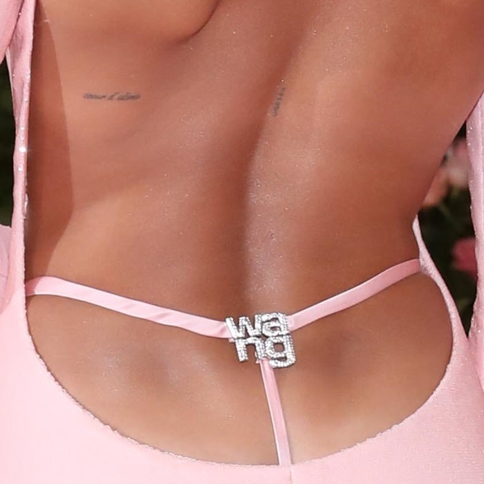 Hailey Bieber's bedazzled g-string with a logo reading WANG right above her butt