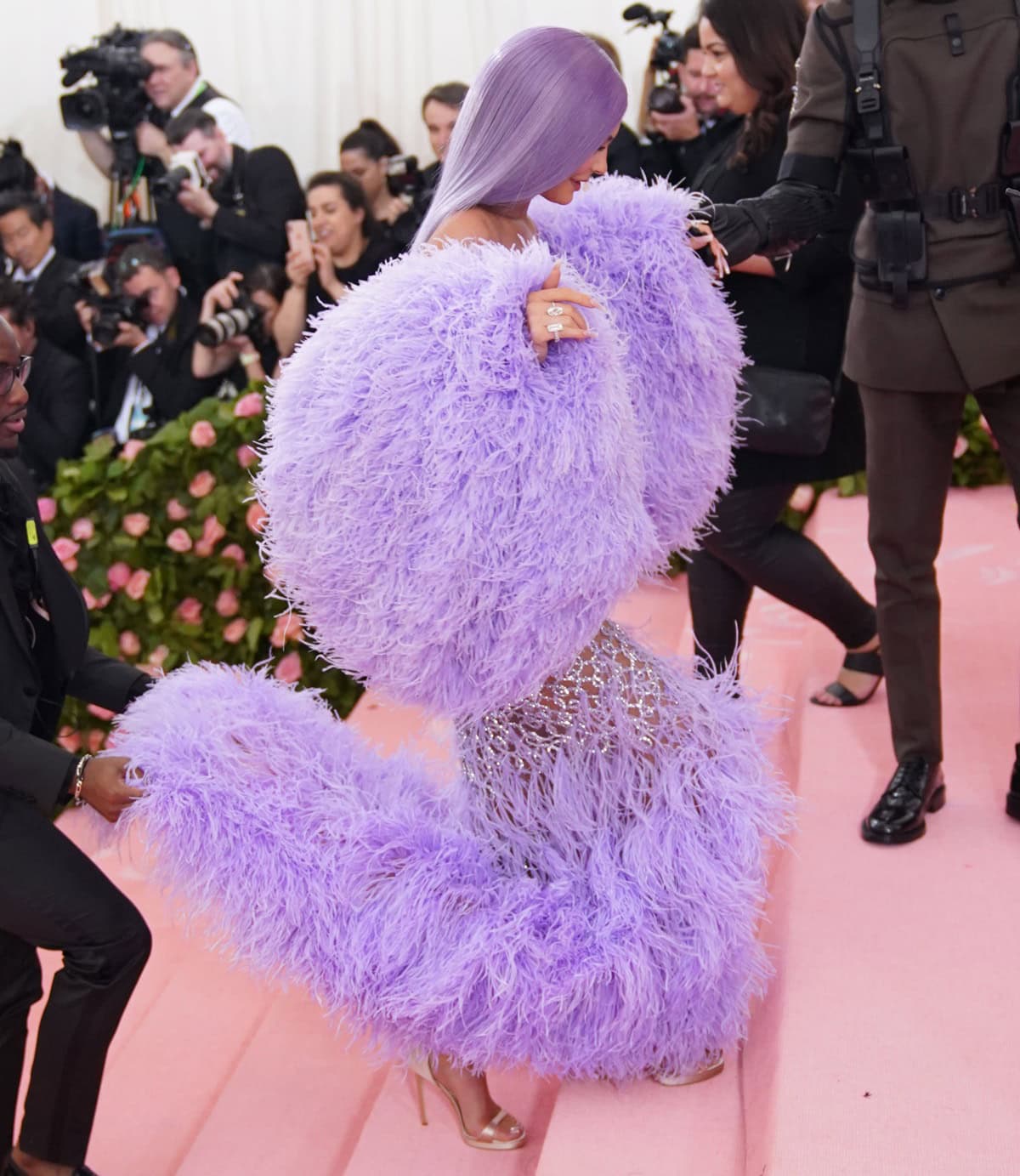 As she ascended the Met Gala stairs, Kylie Jenner’s height-lengthening stiletto heels finally peeked out from beneath her extravagant feathered Versace gown