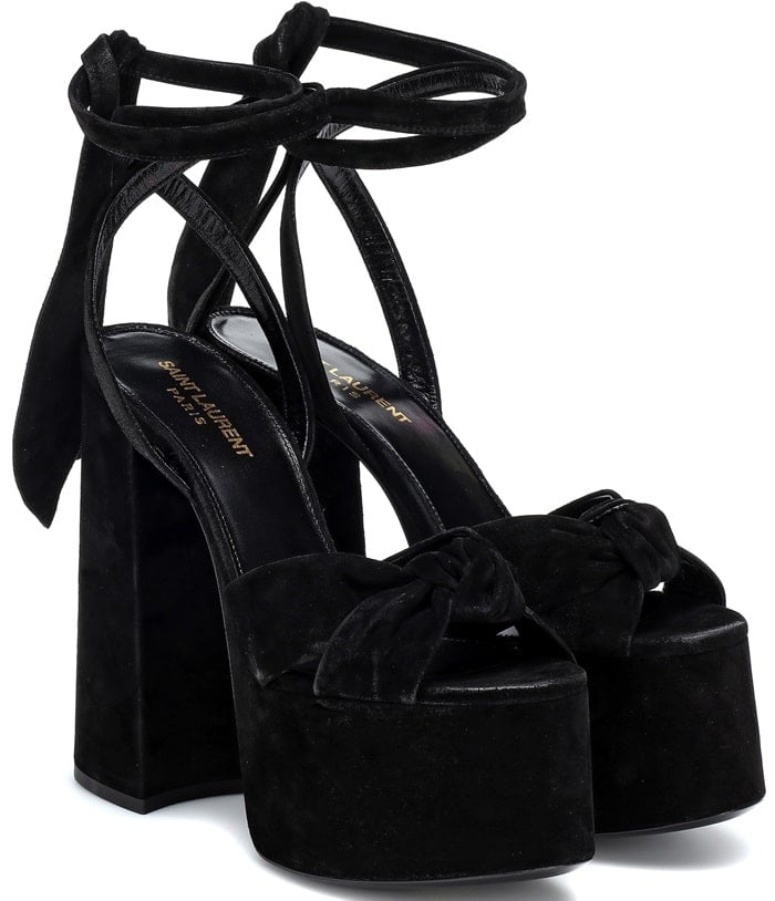 Sky high and super plush, the Paige sandals from Saint Laurent are made from black suede and set on a vertiginous plateau