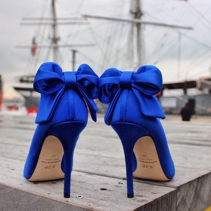 Classic pumps with a large bow and grosgrain trim at the heel