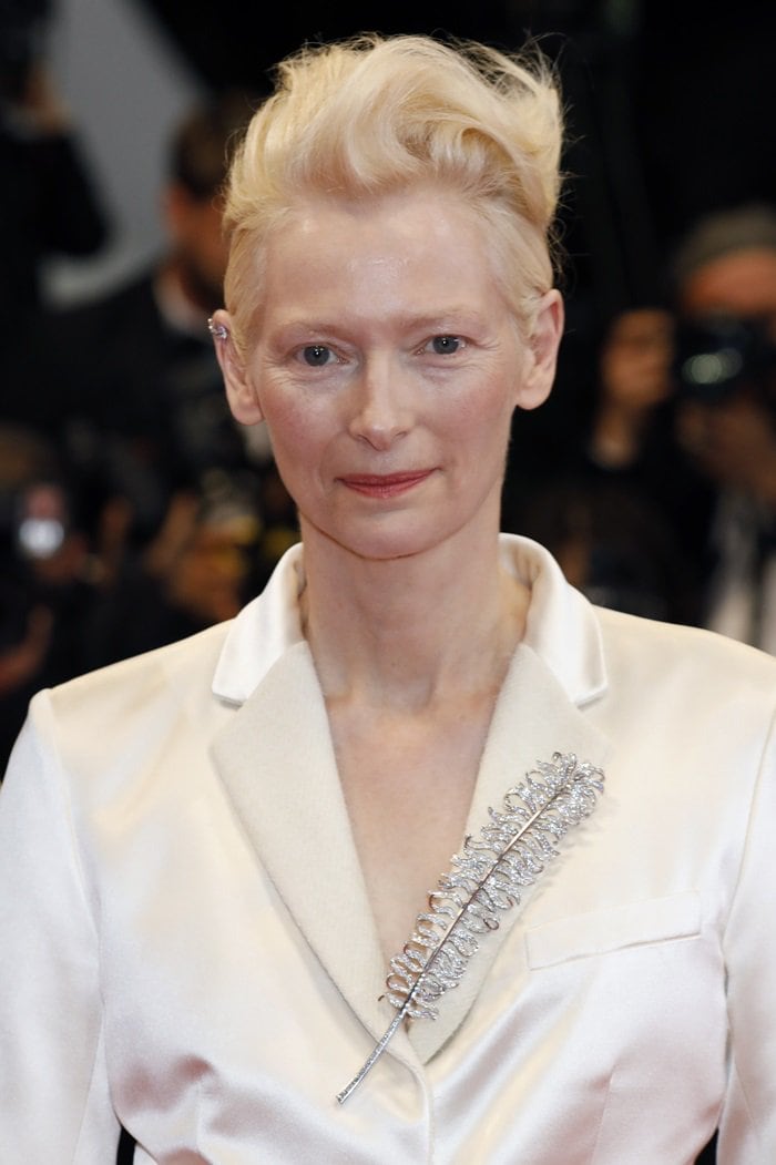 Tilda Swinton's ill-fitting cream satin suit and feather brooch