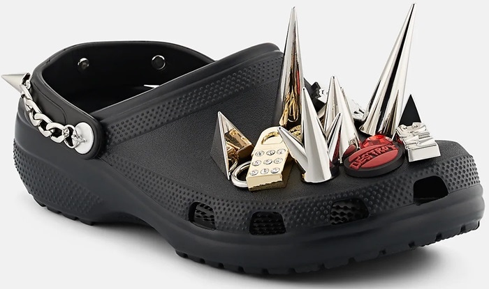 Barneys New York x Crocs' black textured rubber clogs are embellished with assorted mixed-metal studs, spikes, and punk-inspired charms