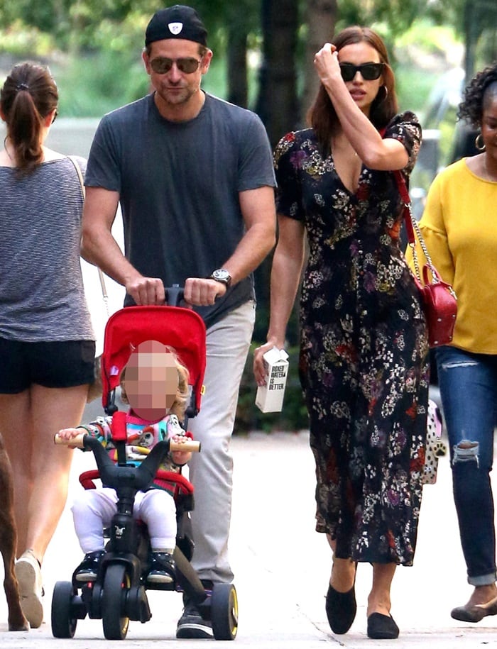Bradley Cooper and his girlfriend Irina Shayk taking a stroll with their daughter Lea