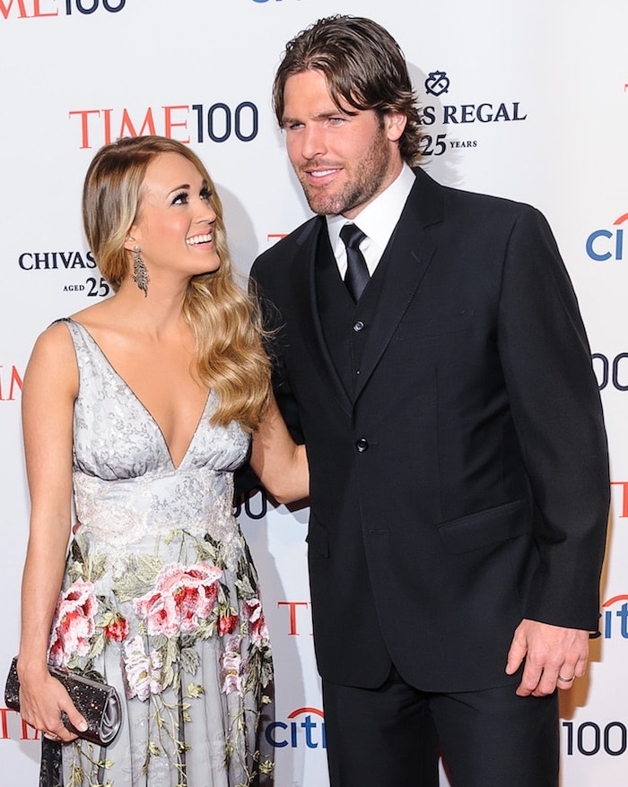 Carrie Underwood wore a floral princess gown as she walked the carpet with husband Mike Fisher at the 2014 Time 100 Gala at The Time Warner Center