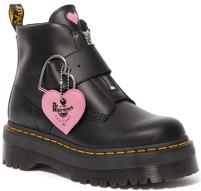 These black boots feature a statement heart shaped nickel buckle and a pink heart tag