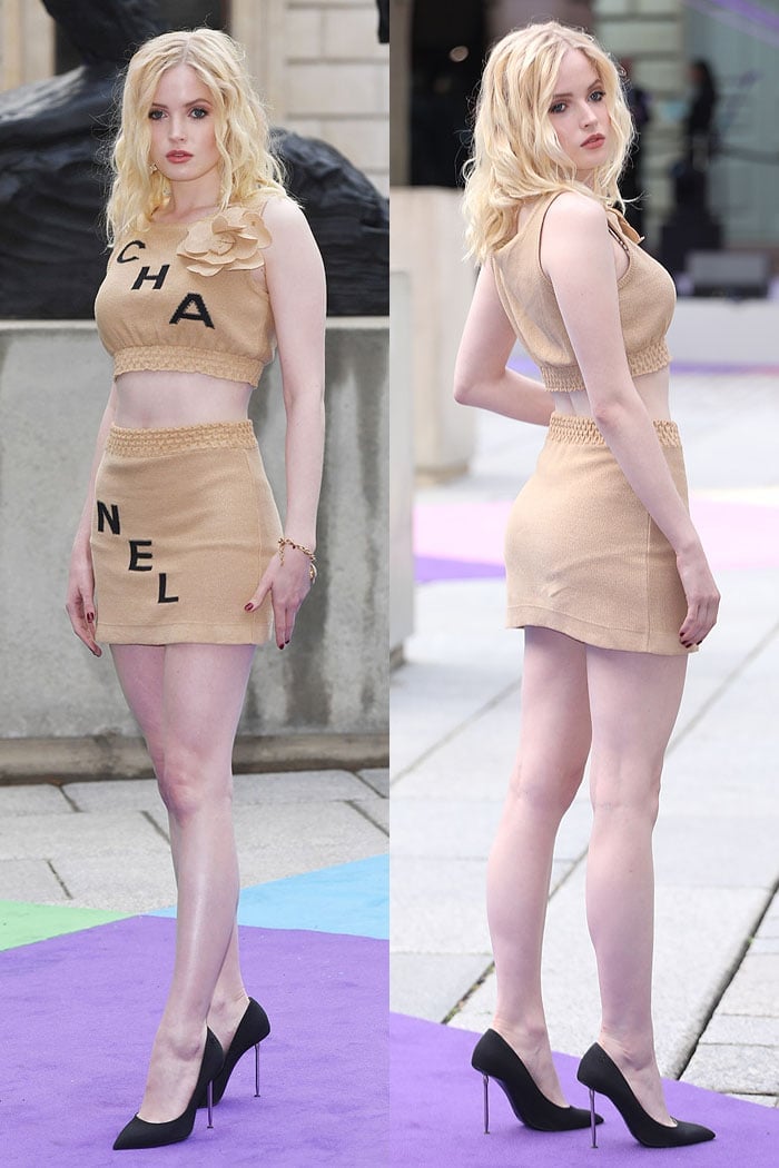 Ellie Bamber flaunted her legs in a Chanel beige-and-black crop top and mini skirt