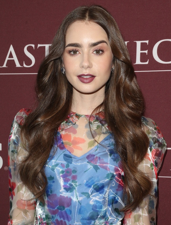Lily Collins kept her hair down and donned dark lips.