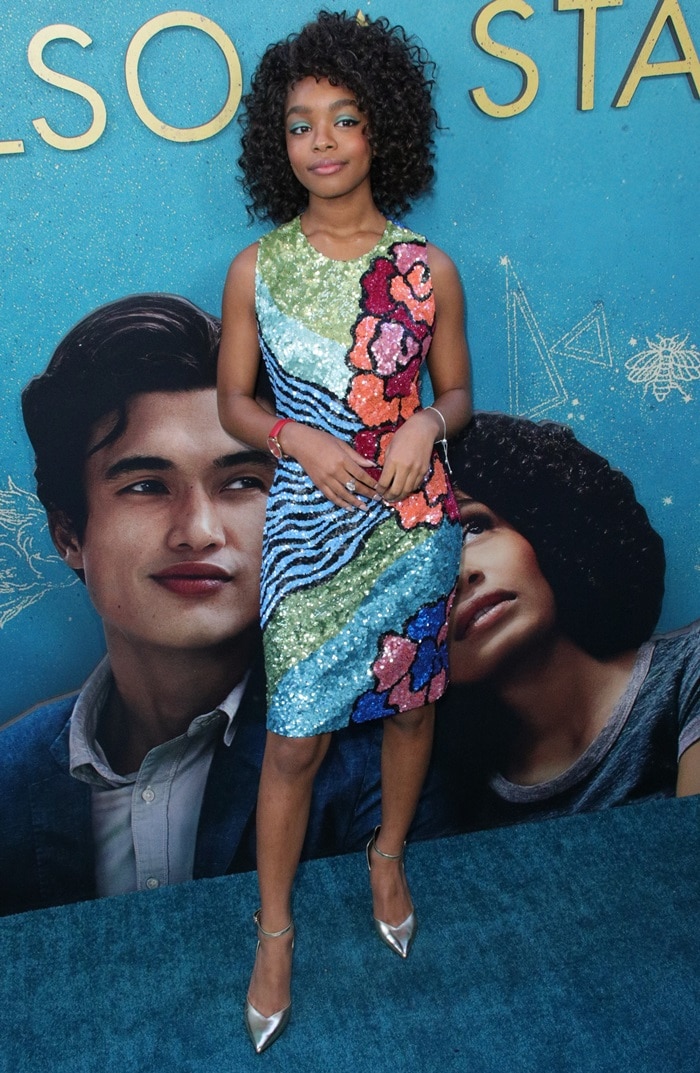 Marsai Martin dazzles in a vibrant, sequined Georges Chakra dress and metallic pumps at The Sun is Also a Star premiere, showcasing her bold and youthful style