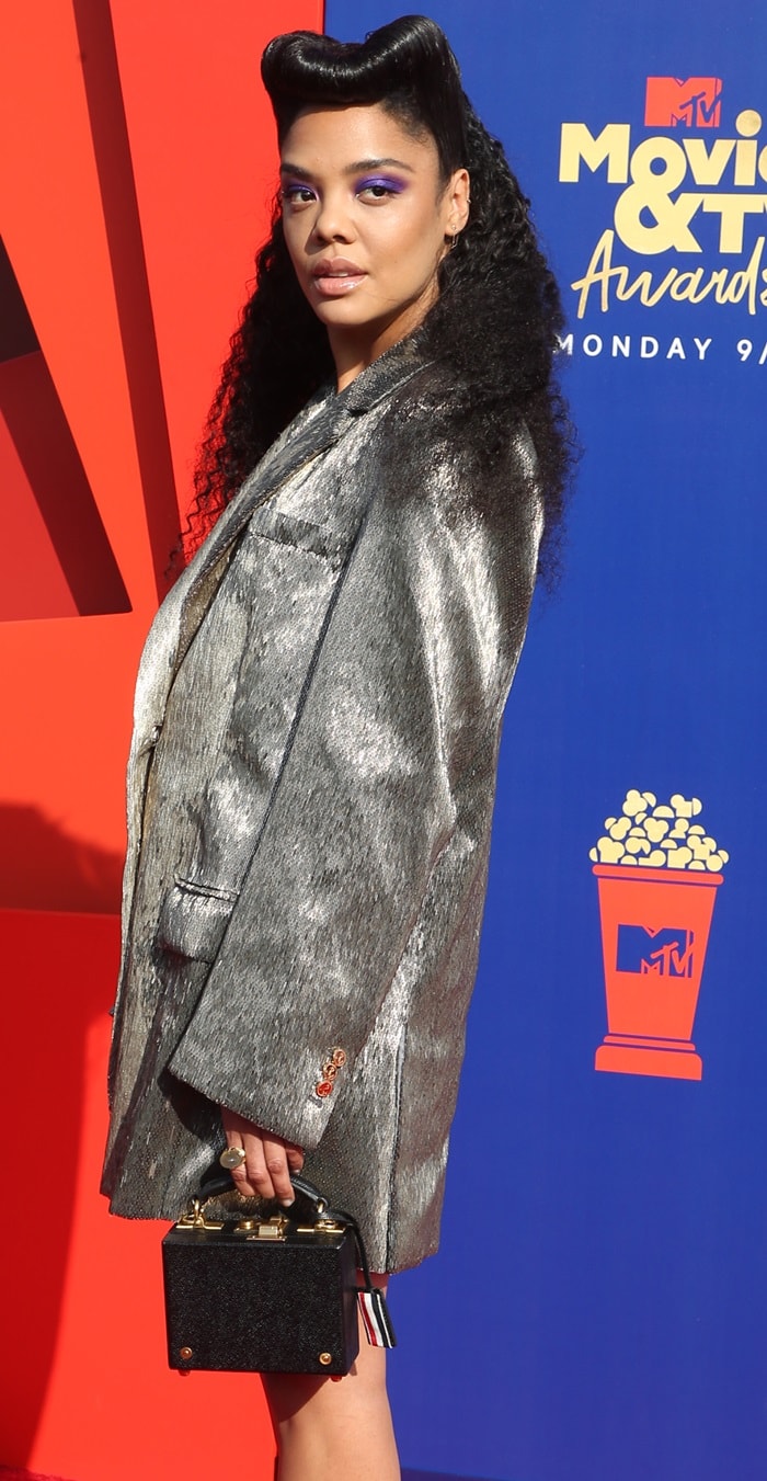 Tessa Thompson toted a black box clutch