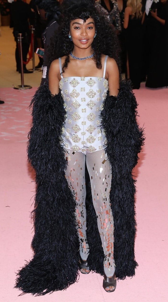 Yara Shahidi with extremely high hair on the pink carpet at the 2019 Met Gala