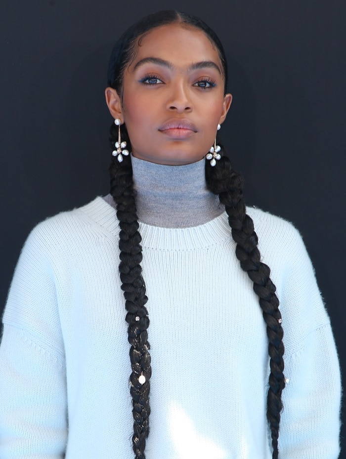 Yara Shahidi wears a sweater and a cashmere turtleneck from Prabal Gurung