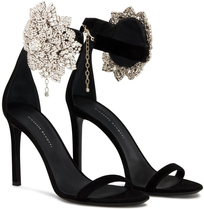 These high-heel, black suede sandals are characterized by the crystal flower accessory on the side