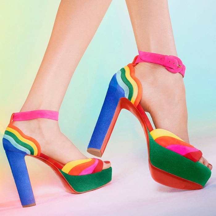 Layers of pure color curve around the counter and arc across the vamp of an ankle strap sandal sent skyward with a wrapped platform and major heel