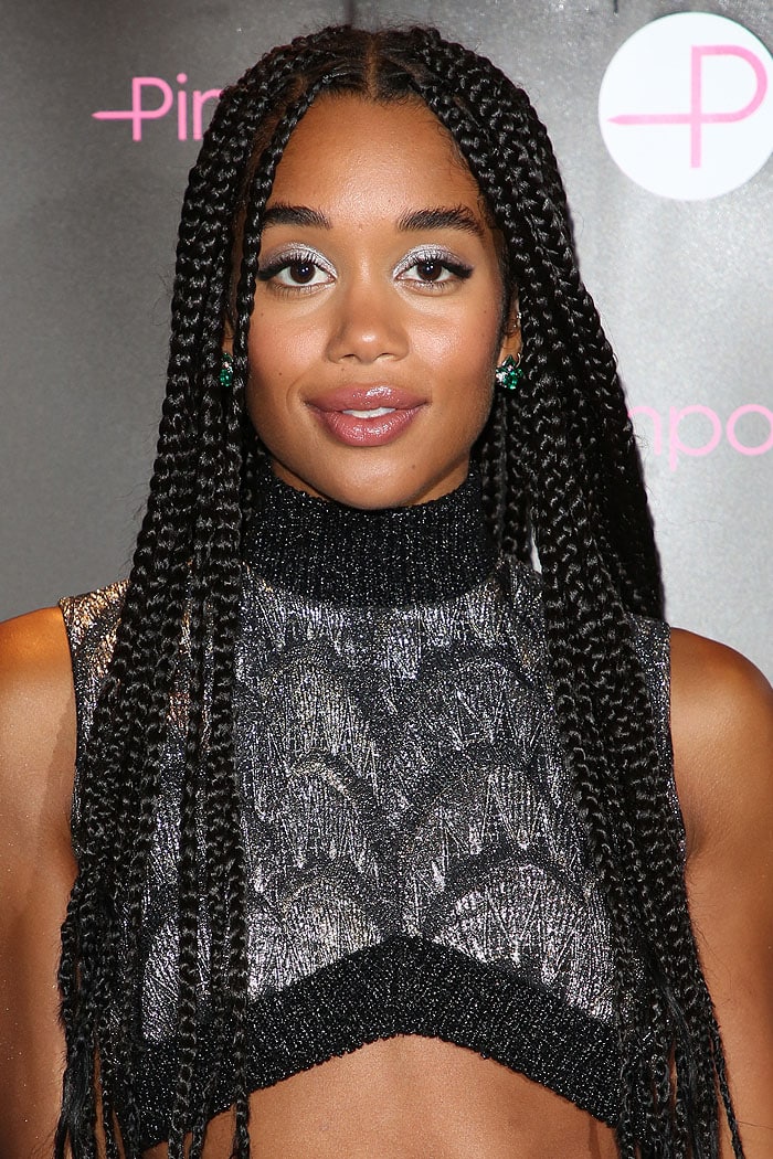 Laura Harrier wearing Bulgari emerald earrings and silver eyeshadow