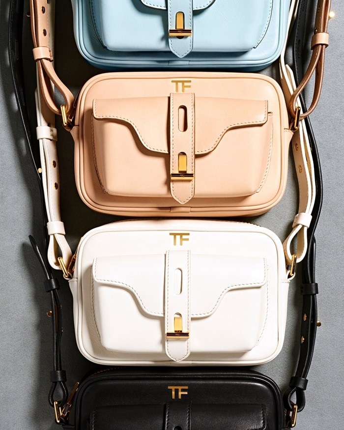 Camera bag from Tom Ford featuring an adjustable shoulder strap, gold-tone hardware, a top zip fastening and a front compartment