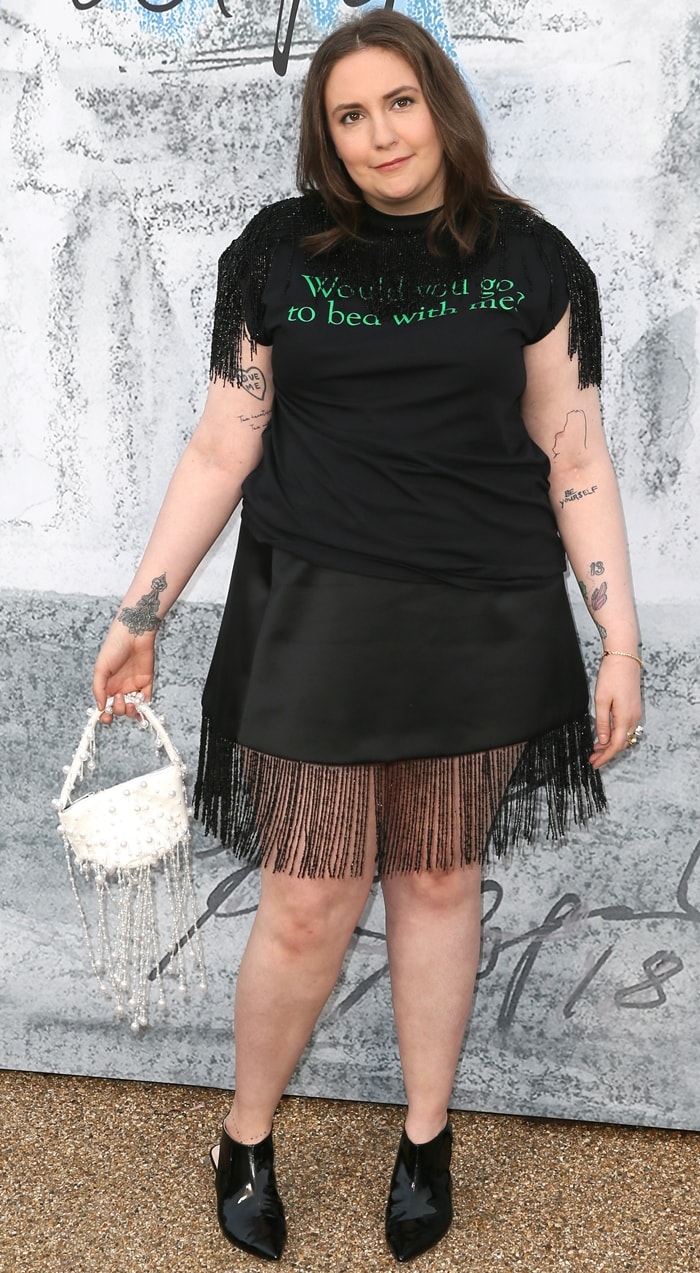 Lena Dunham's slogan print fringe-trimmed T-shirt at the Serpentine Gallery’s Summer Party