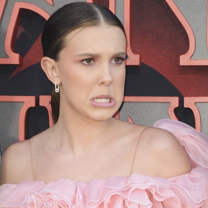 Millie Bobby Brown makes a funny face with her teeth on display