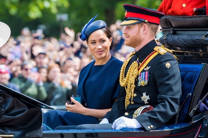 Meghan Markle rides in a carriage with her husband Prince Harry during the Trooping the Colour festivities